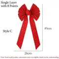 Dettaglio del fiocco natalizio in velluto rosso con stelle dorate, dimensioni 49x26cm - Stile C Stella Glitter
