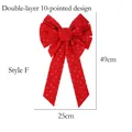 Detail of Style F handmade red velvet Christmas bow with gold star and moon patterns - Style F Glitter Star