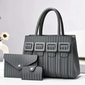 Detailed view of grey 3-piece bag set with vertical texture and stylish square buckles - Gray