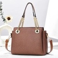 Close-up of brown chain handbag with textured fabric and elegant gold metal hardware - 22cmx11cmx18cm / Earthy Yellow