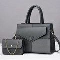 Detail of grey paneled tote set with striped fabric and gold chain mini bag accessory - Gray