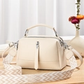 Chic beige lychee leather crossbody bag with patterned strap on wooden surface - L24xH14xW10cm / Off White