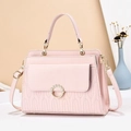 Pink quilted PU leather handbag with elegant wave stitching and pearl buckle detail - Length 27cm Width 10cm Height 18cm / Pink