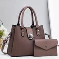 Detail view of the brown pleated bucket bag set with a matching envelope clutch - Coffee