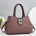 Detailed view of the brown twill fabric texture and elegant silver metal teardrop clasp - L32 W14 H22 / Brown