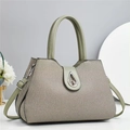 Elegant sage green trapezoid handbag with textured woven finish and metal twist lock - L32 W14 H22 / Dark Khaki