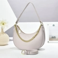 Detail of crescent moon bag with lychee texture leather and gold chain strap accent - Gray