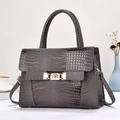 Elegant charcoal grey crocodile pattern handbag with gold clasp and top handle for women - Gray