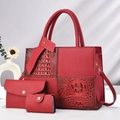 Detailed view of red 3-piece bag set with patchwork crocodile texture and gold hardware - Red