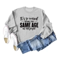 Flat lay of gray crewneck sweatshirt with black artsy text print and blue jeans - S / Grey (Black Font)
