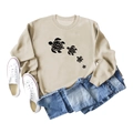 Flat lay of beige turtle print sweatshirt with blue jeans and white sneakers - Sand (Black Font)