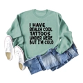 Flat lay of a mint green sweatshirt with funny text paired with jeans and sneakers - S / Light Green
