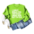 Flat lay of bright green crewneck sweatshirt with tattoos text, jeans and sneakers - S / Fluorescent Green