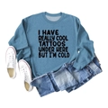 Blue crewneck sweatshirt with I Have Really Cool Tattoos slogan flat lay style - S / Blue