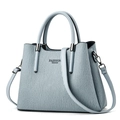 Close-up of light blue pleated handbag with dual handles and Fashion Queen lettering - Blue
