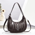 Detail of dark brown half-moon shoulder bag with vertical embossed texture and silver hardware - Coffee