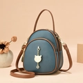 Drielagige marineblauwe crossbodytas van leer met kattenhanger en bruine contrasterende bies - Blauw