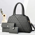 Detailed view of dark grey three-piece handbag set with elegant quilted texture and gold hardware - Handbag, Clutch And Card Holder / Gray