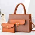 Detail view of woven caramel composite tote bag and matching clutch set with metal clasp - Earthy Yellow / 30x12x23cm