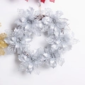 Silver glitter Christmas wreath with hollow poinsettia flowers on brown vine base - 35cm Silver Hollow Rattan Ring
