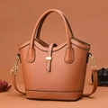 Brown lychee grain bucket bag with dual handles and gold hardware in studio setting - Earthy Yellow / 30 x 12 x 23cm