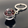 Close-up of a silver firefighter badge keychain with glass dome and cross symbols - Proud To Be Firefighter Logo (XSWX2244-6)