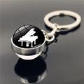 Μινιμαλιστικό μπρελόκ πιάνο από γυαλί και μέταλλο σε φόντο καθρέφτη με κομψό σχέδιο - Στυλ Πιάνο (XSWX2246-2)