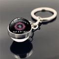 Detail of Firefighter's Wife round metal keychain with pink maltese cross under glass - Firefighter's Wife Pink Cross (XSWX2244-8)
