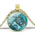 Detail of round bronze necklace featuring sea turtle pattern under glass dome - Sea Turtle Pattern (XSWX3529-5)