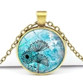 Macro shot of bronze vintage pendant necklace with blue dandelion glass dome detail - Dandelion Pattern (XSWX3529-7)