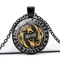 Macro view of Viking wolf head necklace with circular Runic symbols on black base - Black Gold Dual Wolves (JY006280-6)