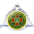 Macro detail of Ukraine National Guard emblem under glass on a silver pendant - National Guard Emblem Style (JY006291-4)