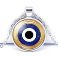 Detail of blue evil eye glass pendant with gold leaf accents on silver chain - Gold Foil Embellished Evil Eye Style (JY006323-3)