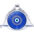 Macro shot of silver-colored evil eye pendant with blue glass concentric circles - Three-Layer Concentric Evil Eye Style (JY006323-4)