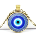 Macro detail of Evil Eye necklace featuring blue glass pendant and antique bronze chain - Classic Blue Black Eye Style (JY006321-5)