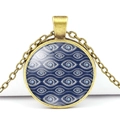 Detailed macro of a round blue evil eye glass pendant with vintage bronze metal frame - Geometric Texture Pattern Style (JY006321-6)