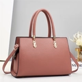 Dusty rose macaron handbag in textured leather with gold hardware and top handles - Pink