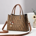 Brown leather tote bag with logo pattern and decorative shell charm on handles - L26 W11 H19 / Brown