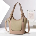 Detail of a beige leather bucket bag featuring woven panels and gold hardware accents - L16 W11 H21 / Khaki