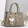 Elegant beige woven handbag with avocado green leather trim and plush ball charm detail - L28 W12 H20 / Cyan