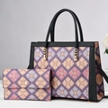 Detail of floral tote and wallet set with purple floral pattern and gold hardware - Purple
