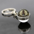 Detail of Viking compass keychain with sword and golden wings inside a glass pendant - Sword Wings Runes Style (JY006535-5)