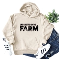 Detail of beige Farm hoodie with Life Is Better print and front pocket design - S / Sand