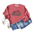 Flat lay of girl MAMA terracotta sweatshirt with leopard print text and denim shorts - Red (Black Print)