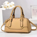 Macro view of khaki boston bag with lychee leather texture and gold hardware detail - L26cmxW13cmxH15cm / Beige