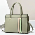 Detail of green and cream color block handbag with gold hardware on minimalist background - Medium / Green