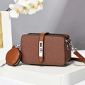 Close-up of brown textured multi-layer crossbody bag with mini round coin purse detail - Earthy Yellow