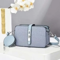 Light blue denim texture crossbody bag with matching round coin purse on white pedestal - Sky Blue