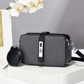 Black textured camera bag set with round coin purse and silver hardware on white pedestal - Black