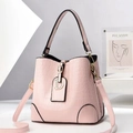 Pink faux croc leather bucket bag with gold D-charm and adjustable shoulder strap - Pink